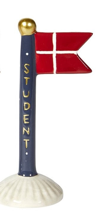 keramik flag i blå med hvide prikker og guldfarvet tekst: student.
