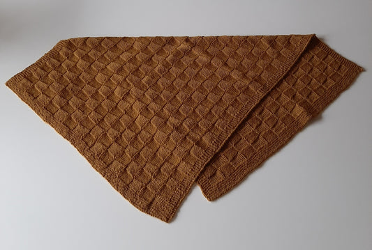 håndstrikket babytæppe.